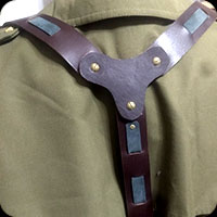 Detail of leather suspenders with woven straps and "Y" back to lobster clips.