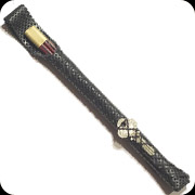 Chopstick holster with key in the lacing.  The leather has a small hole punch pattern.